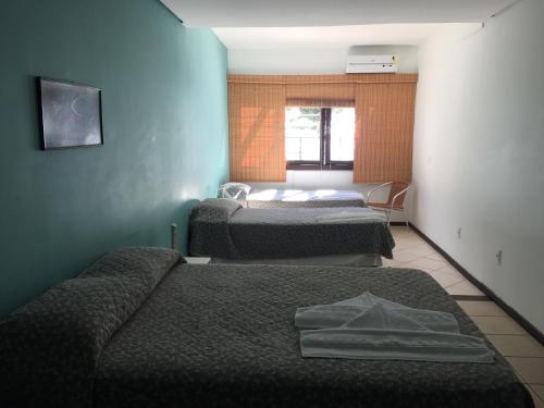 Imagen de la habitación del Hotel Pousada Dos Golfinhos. Foto 8