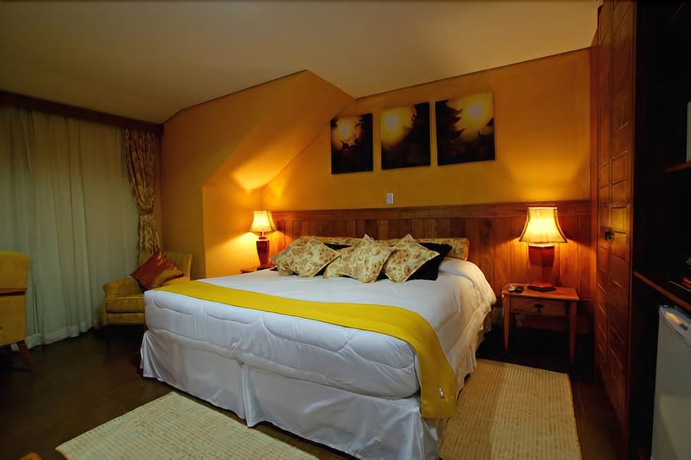 Imagen de la habitación del Hotel Pousada Dotto Chateau. Foto 11