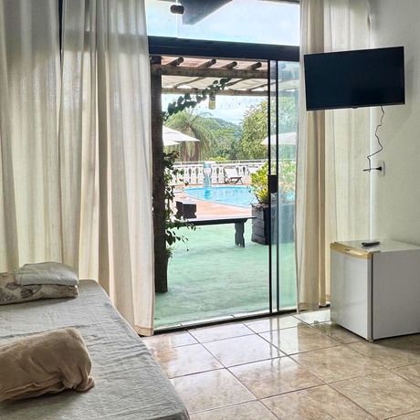 Imagen de la habitación del Hotel Pousada Encantos da Serra Macacos. Foto 14