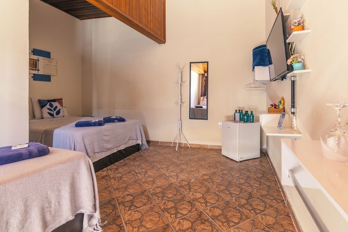 Imagen de la habitación del Hotel Pousada Encantos de Socorro. Foto 2