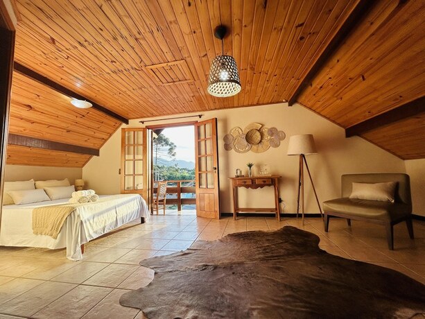 Imagen de la habitación del Hotel Pousada Flor de Lua Monte Verde. Foto 17
