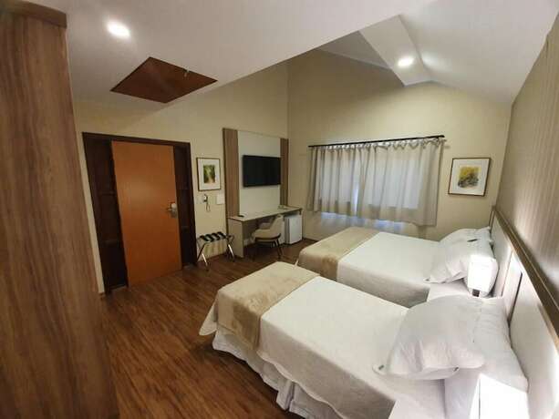 Imagen de la habitación del Hotel Pousada Golden Garden. Foto 17