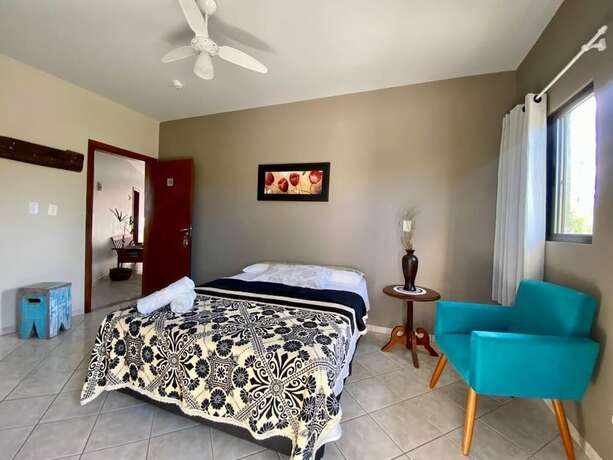 Imagen de la habitación del Hotel Pousada La Ferrugem Suites. Foto 16