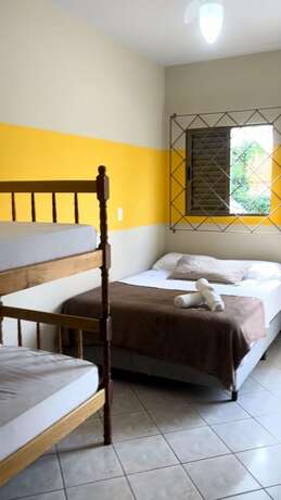 Imagen de la habitación del Hotel Pousada La Ferrugem Suites. Foto 17