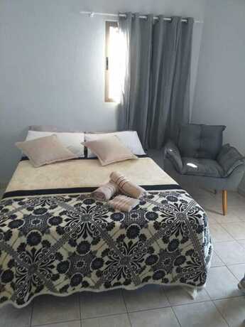 Imagen de la habitación del Hotel Pousada La Ferrugem Suites. Foto 18