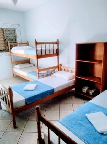 Imagen de la habitación del Hotel Pousada La Ferrugem Suites. Foto 19