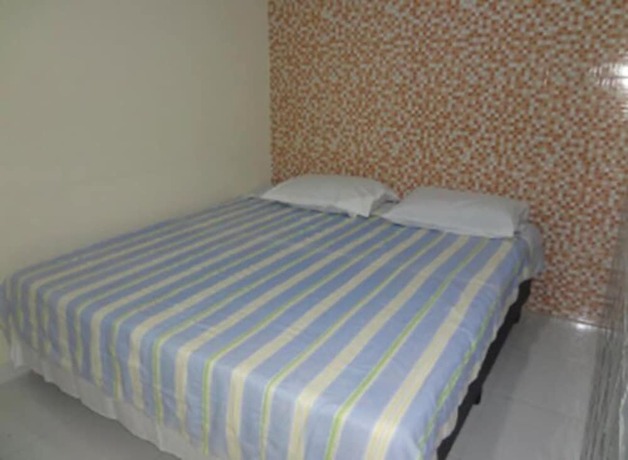 Imagen de la habitación del Hotel Pousada Pg One. Foto 22