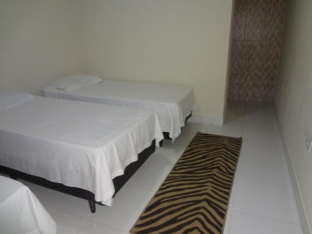 Imagen de la habitación del Hotel Pousada Pg One. Foto 26