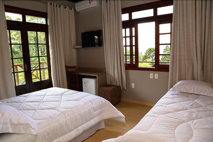 Imagen de la habitación del Hotel Pousada Tr&ecirc;s Pinheiros. Foto 12
