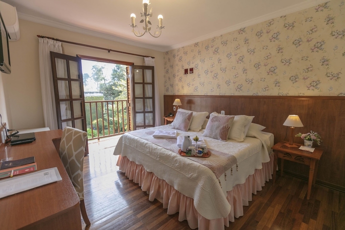 Imagen de la habitación del Hotel Pousada das Hort&ecirc;nsias, Campos do Jordao. Foto 16