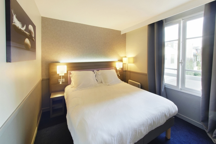 Imagen de la habitación del Hotel Poussin. Foto 13