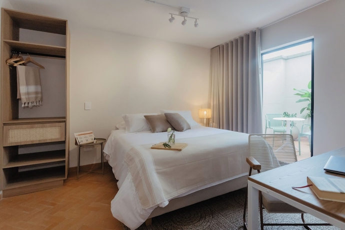Imagen de la habitación del Hotel Pranik Living Co-mmunity. Foto 3