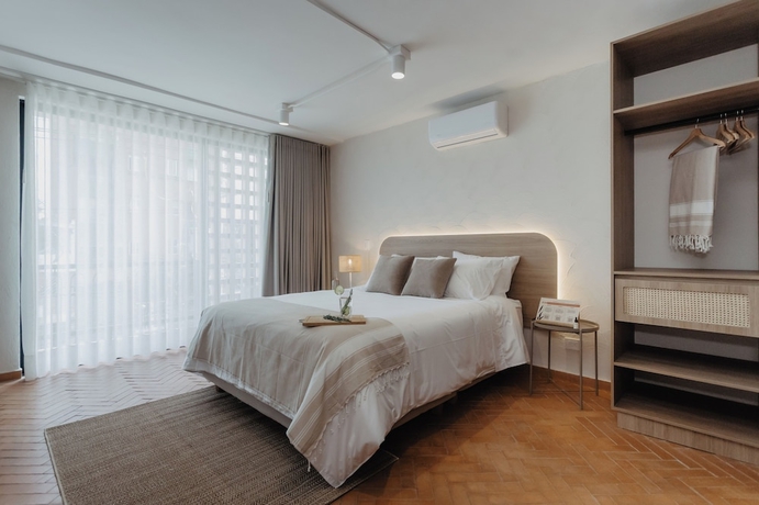 Imagen de la habitación del Hotel Pranik Living Co-mmunity. Foto 10