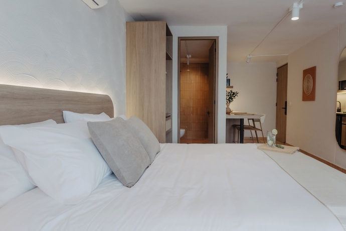 Imagen de la habitación del Hotel Pranik Living Co-mmunity. Foto 11