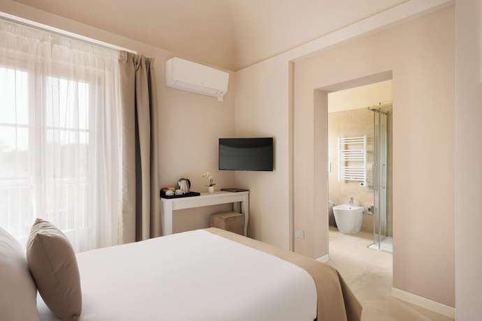 Imagen de la habitación del Hotel Prato dei Miracoli Residenza d'Epoca. Foto 9