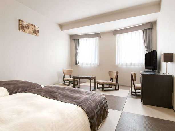 Imagen de la habitación del Hotel Premier Cabin Sapporo. Foto 11