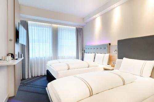 Imagen de la habitación del Hotel Premier Inn Frankfurt Westend. Foto 17