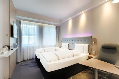 Imagen de la habitación del Hotel Premier Inn Frankfurt Westend. Foto 18