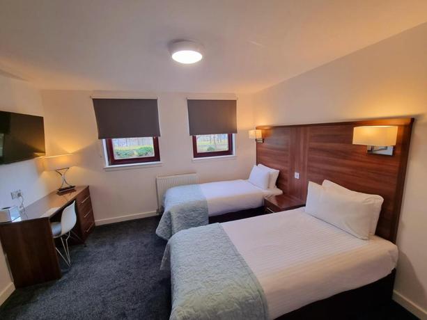 Imagen de la habitación del Hotel Premier Lodge. Foto 4