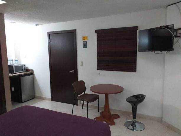 Imagen de la habitación del Hotel Premier Suites. Foto 7