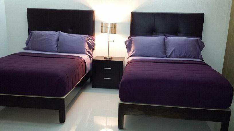 Imagen de la habitación del Hotel Premier Suites. Foto 12