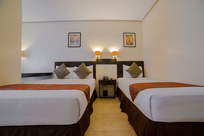 Imagen de la habitación del Hotel Premiere Citi Suites. Foto 5