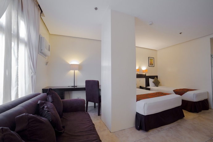 Imagen de la habitación del Hotel Premiere Citi Suites. Foto 7