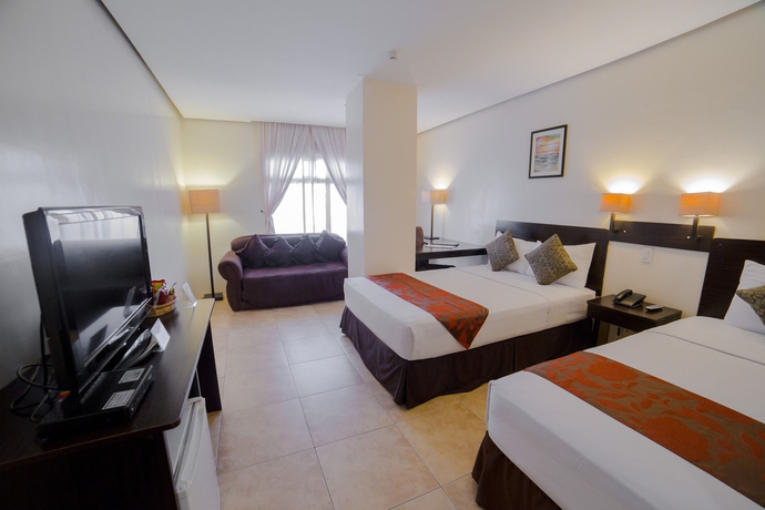 Imagen de la habitación del Hotel Premiere Citi Suites. Foto 9