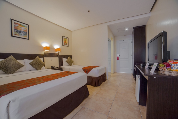 Imagen de la habitación del Hotel Premiere Citi Suites. Foto 10