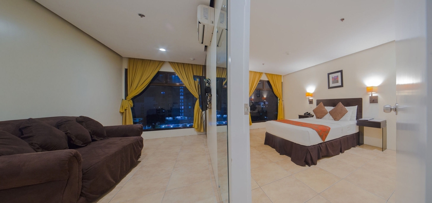 Imagen de la habitación del Hotel Premiere Citi Suites. Foto 11
