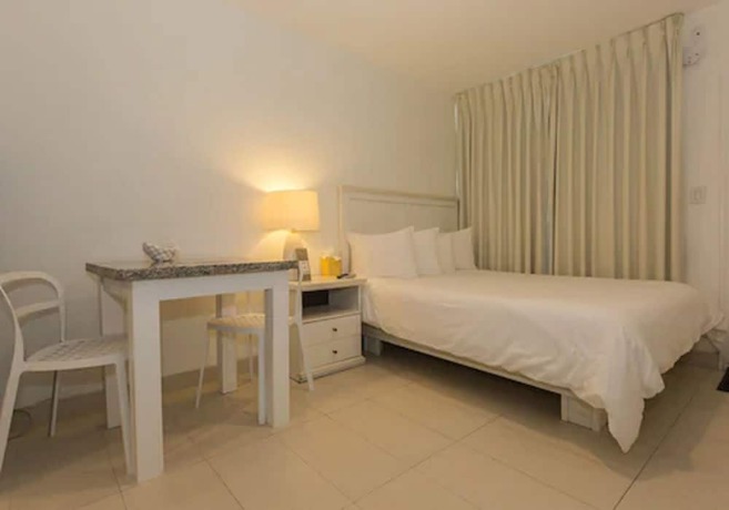 Imagen de la habitación del Hotel Premiere Hotel. Foto 11