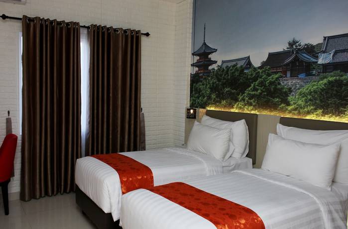 Imagen de la habitación del Hotel Premiere Tegal. Foto 19