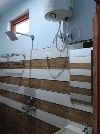 Imagen de la habitación del Hotel Premji And Restaurant. Foto 15