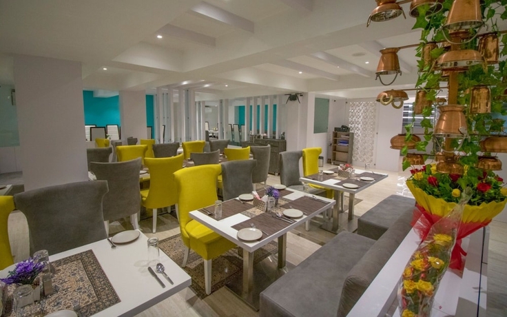 Imagen del bar/restaurante del Hotel Pride By Samrat. Foto 3