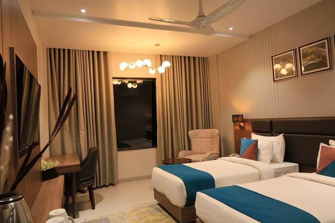Imagen de la habitación del Hotel Pride Comfort Dwarka. Foto 17