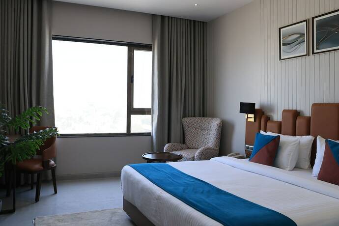Imagen de la habitación del Hotel Pride Comfort Dwarka. Foto 22