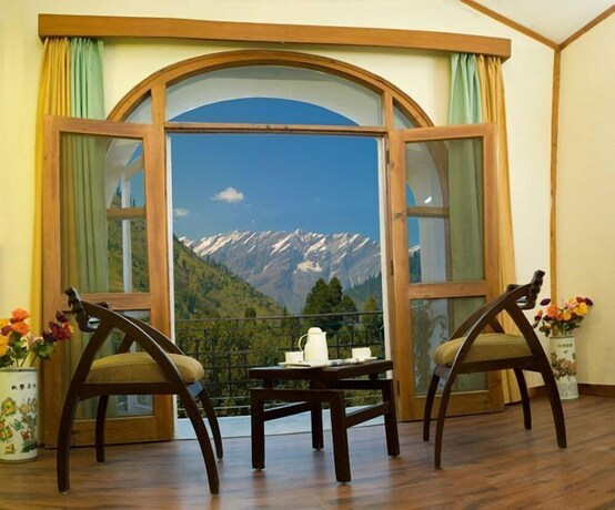 Imagen de la habitación del Hotel Pride De Vivendi Resort Manali. Foto 21