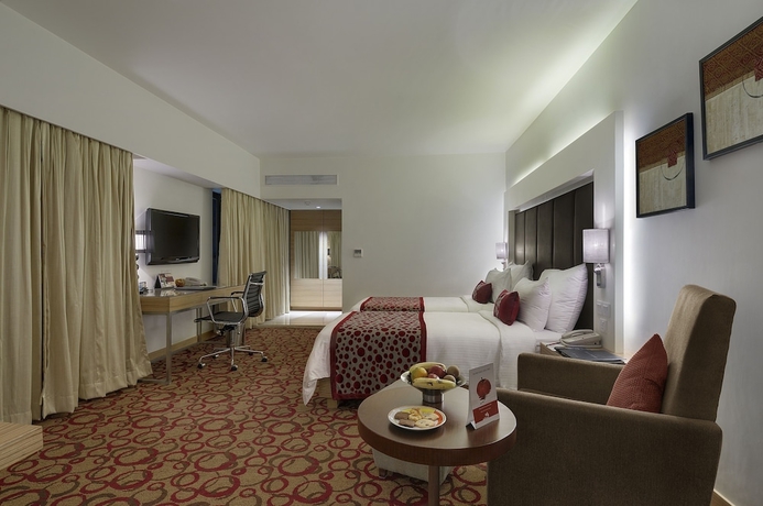 Imagen de la habitación del Hotel Pride Plaza , Ahmedabad. Foto 4