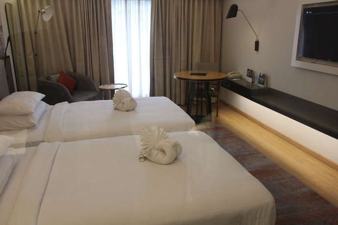 Imagen de la habitación del Hotel Pride Plaza , Ahmedabad. Foto 12