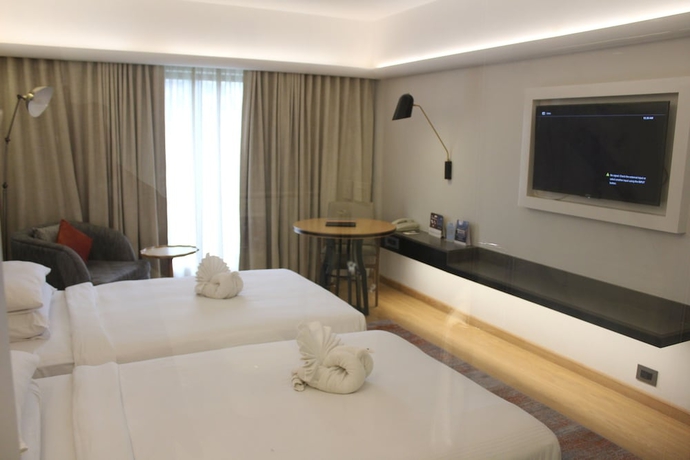 Imagen de la habitación del Hotel Pride Plaza , Ahmedabad. Foto 13