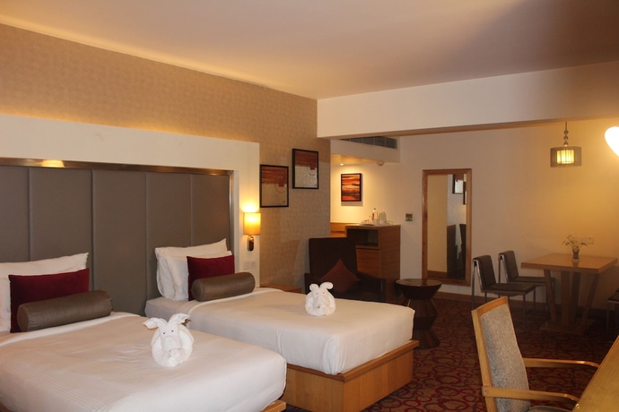 Imagen de la habitación del Hotel Pride Plaza , Ahmedabad. Foto 15