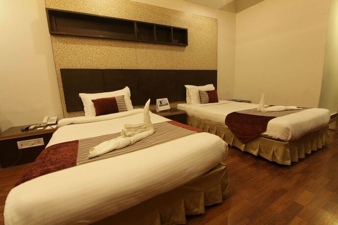 Imagen de la habitación del Hotel Pride Surya Mountain Resort Dharamshala. Foto 17