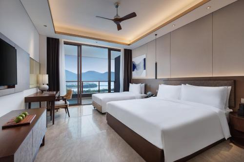 Imagen de la habitación del Hotel Primus Sanya Pleasant Bay. Foto 4