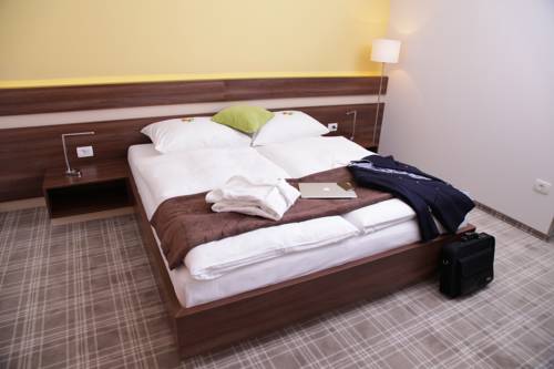 Imagen de la habitación del Hotel Primus & Apartments. Foto 15