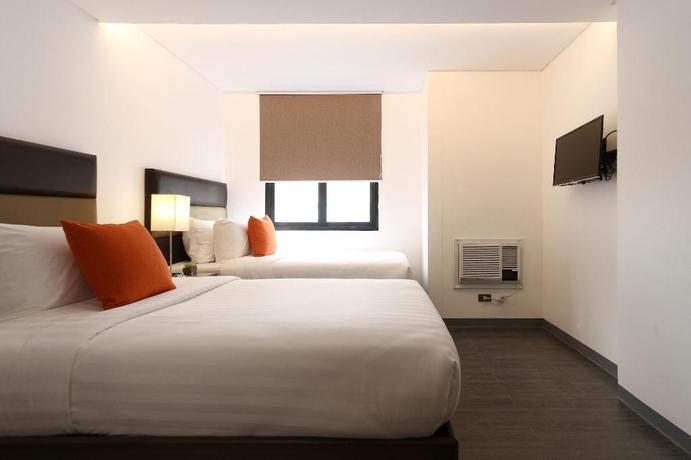 Imagen de la habitación del Hotel Privato Makati. Foto 16