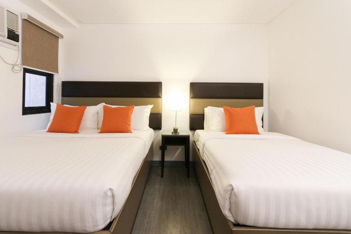 Imagen de la habitación del Hotel Privato Makati. Foto 17