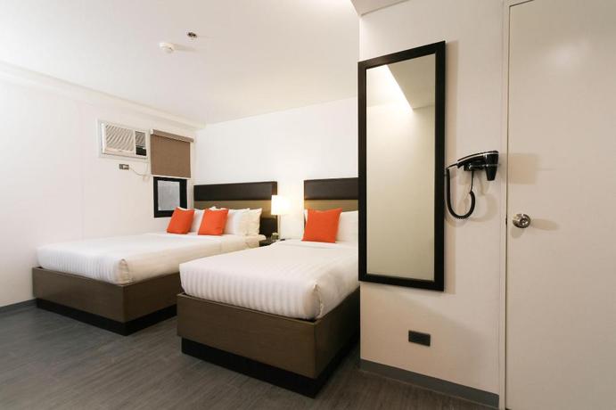 Imagen de la habitación del Hotel Privato Makati. Foto 19