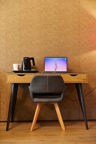 Imagen de la habitación del Hotel Promenada Studios. Foto 10