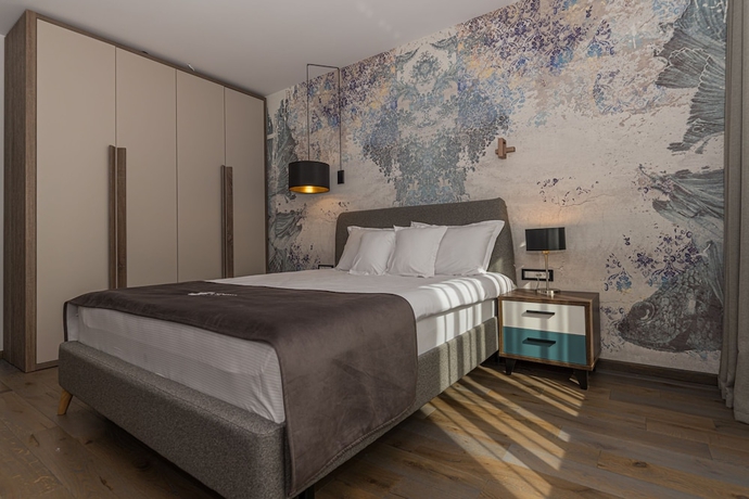 Imagen de la habitación del Hotel Promenada Studios. Foto 11