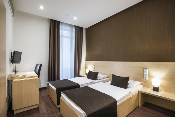 Imagen de la habitación del Hotel Promenade City. Foto 9